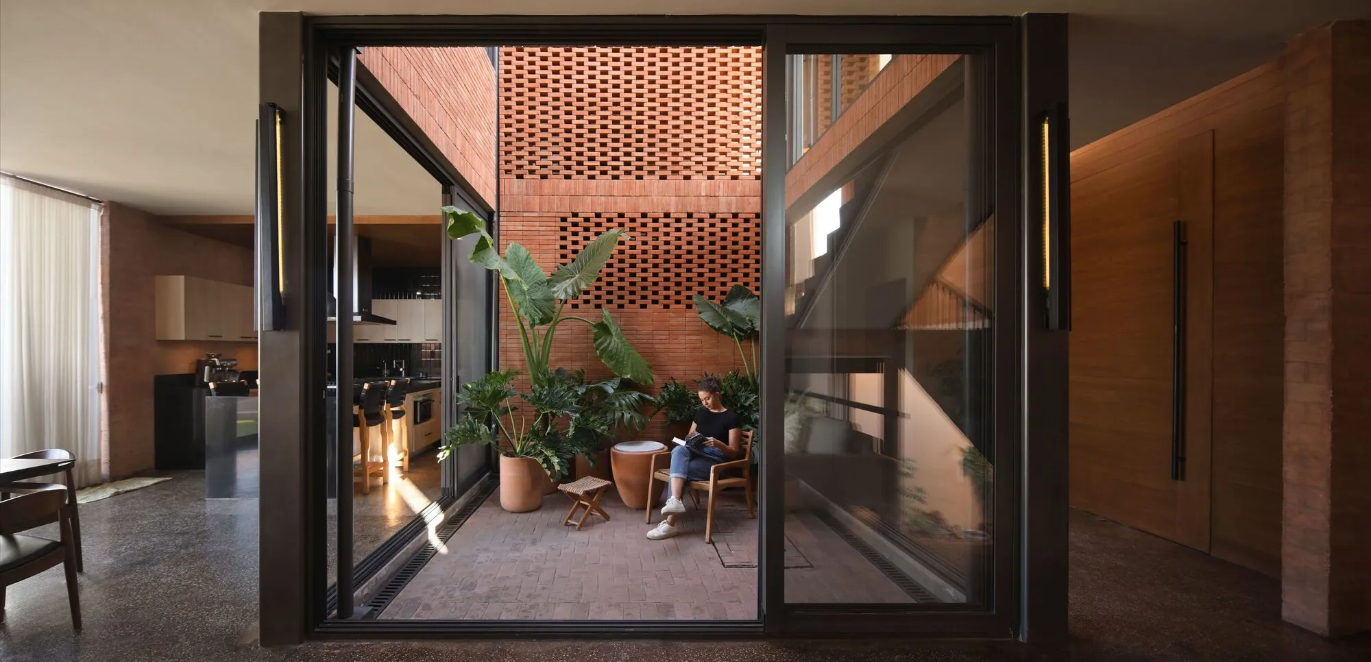 Estudio Mero Builds a Terracotta House Around a Central Patio in Querétaro's White Suburbs