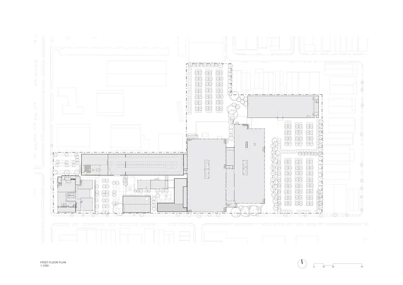 First floor plan drawing showing two large open volumes connected by circulation zones