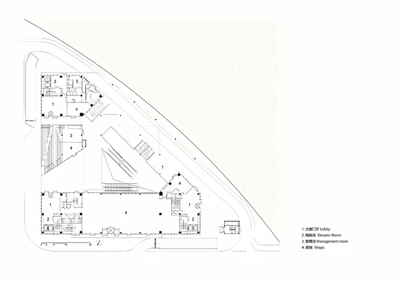 Floor plan drawing showing triangular site with large central atrium space and angled perimeter circulation paths
