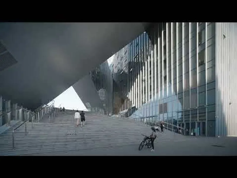 Exterior staircase with vertical metal fins along glass facade under dark overcast sky