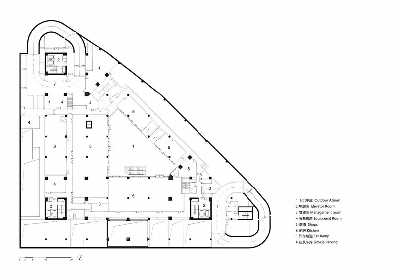 Floor plan drawing showing a triangular podium level with shops and parking circulation