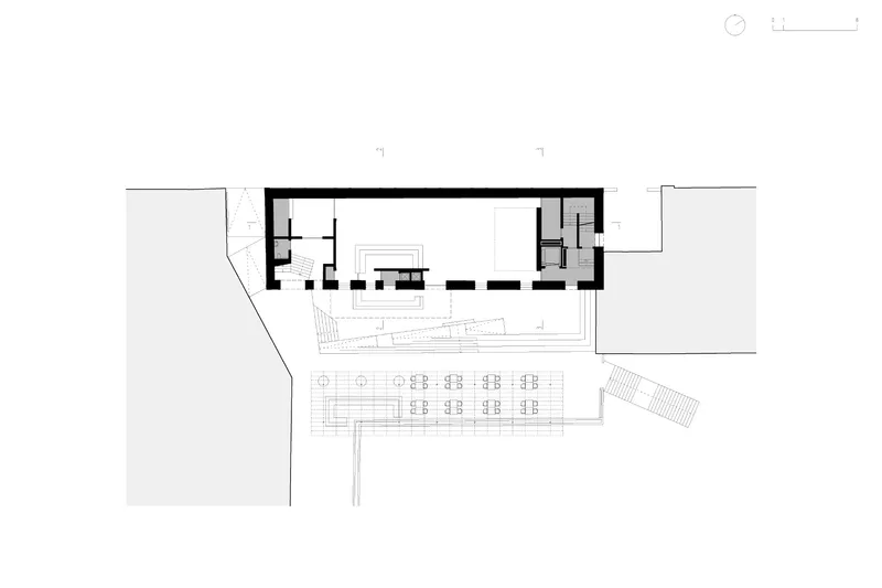 Ground floor plan drawing showing a rectangular building with an open courtyard area and service spaces