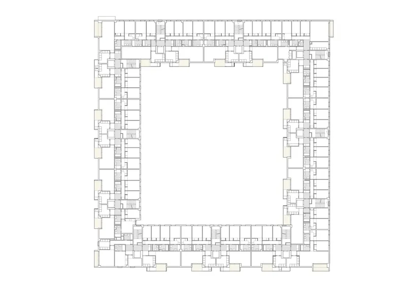 Floor plan drawing showing residential units arranged around a large open central courtyard space