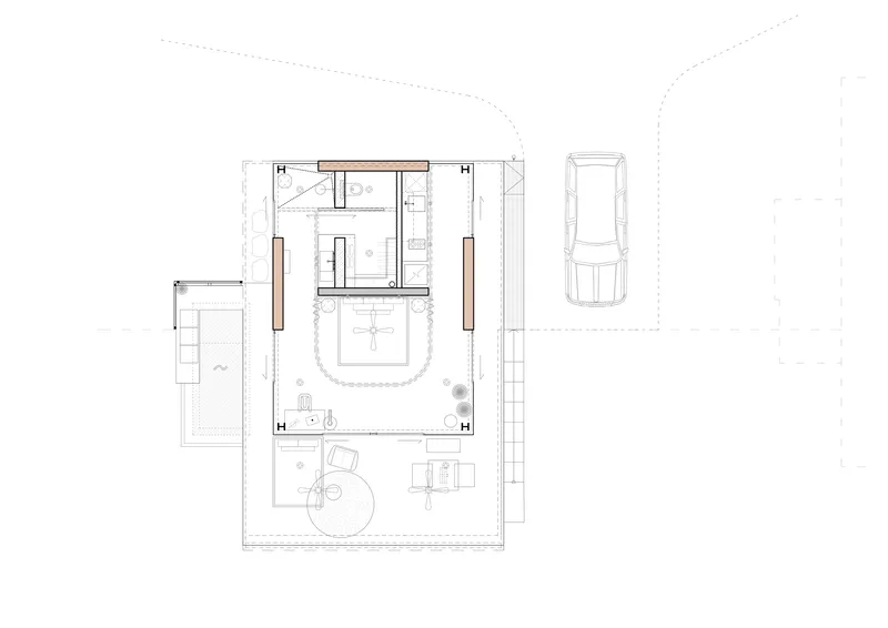 Floor plan drawing showing compact residence with central courtyard and attached carport