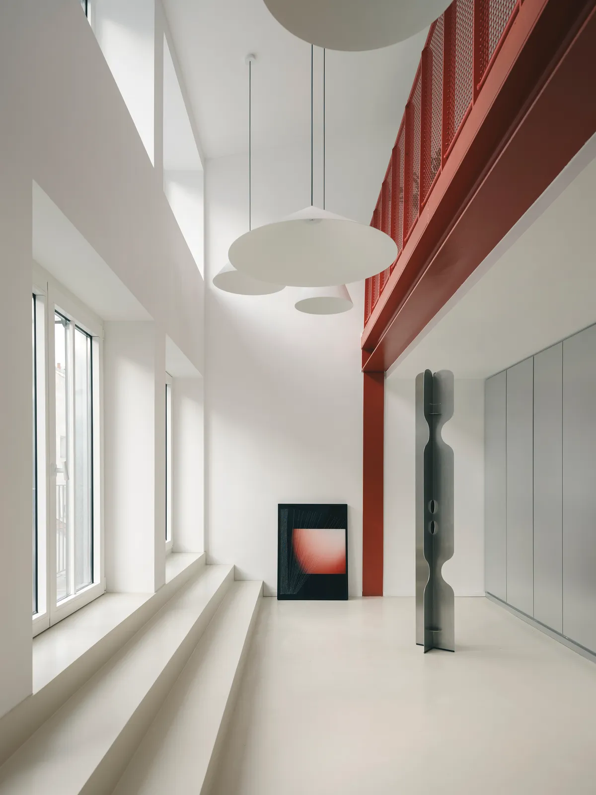 Three Studios Revive a Paris Printing House as a Red-Framed Workplace in the Sentier