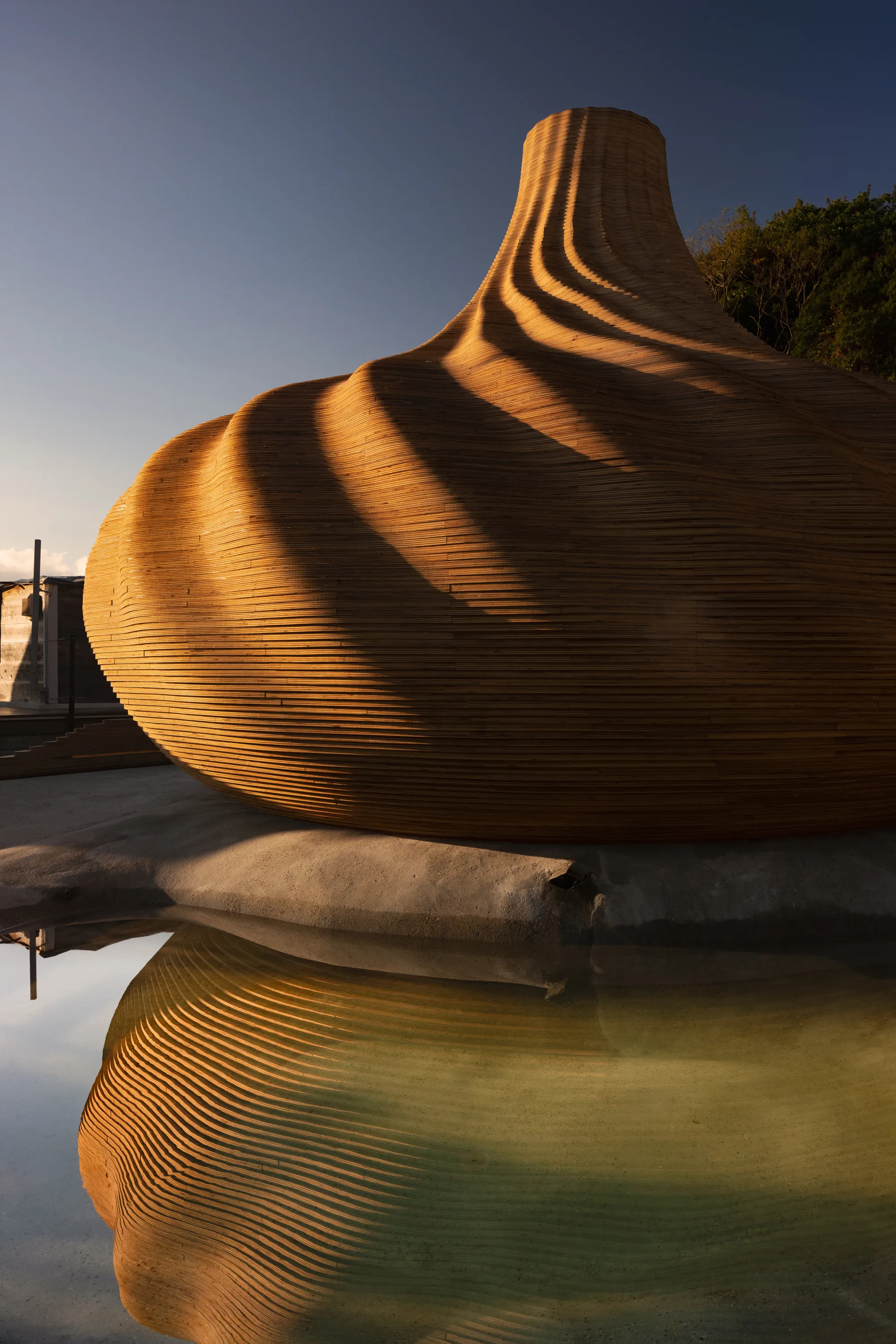 Kengo Kuma Stacks 1,500 Plywood Sheets into a Shell-Shaped Sauna on Naoshima
