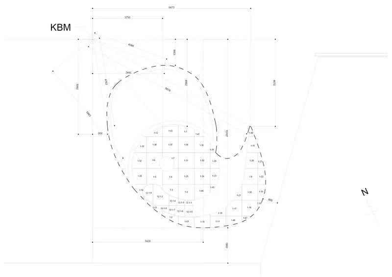Site plan drawing with dashed outline indicating the curved building perimeter and dimensional grid