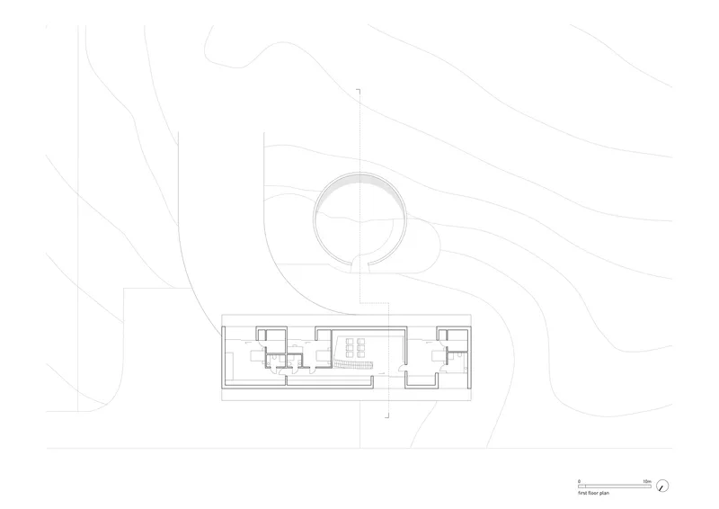 First floor plan drawing revealing a circular upper level connected to a linear wing