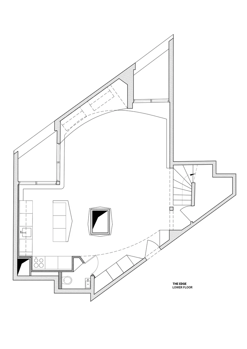 Floor plan drawing showing lower level with kitchen, bath, stair and angled exterior walls