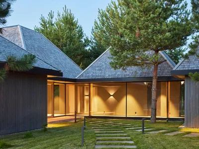 HEIMA Architects Scatters Four Oak-Shingled Pavilions Among the Pines of Northern Lithuania