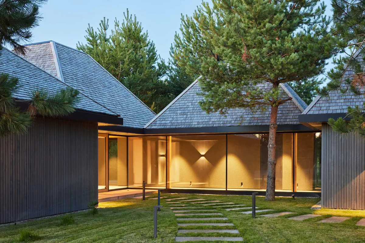 HEIMA Architects Scatters Four Oak-Shingled Pavilions Among the Pines of Northern Lithuania