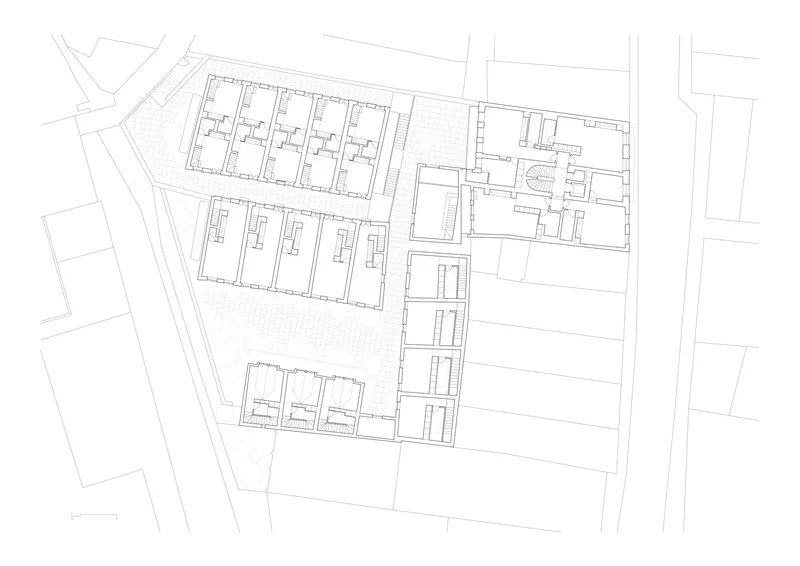 Floor plan drawing showing repeated unit layouts in two parallel blocks with central circulation spine