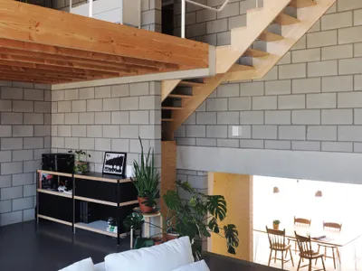 UR Architects Carve a Split-Level Family Home into a Belgian Sand Ridge