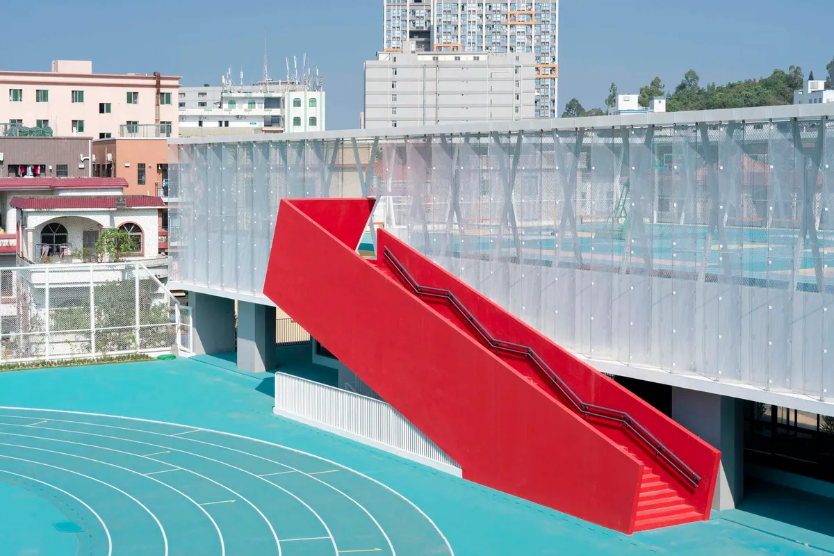 Atelier cnS Stacks a Running Track Above Flexible Classrooms in a Dense Pearl River Delta School