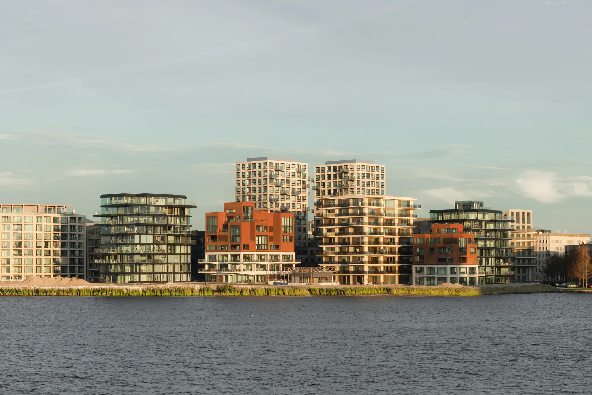 Powerhouse Company, Orange Architects, and NEXT Architects Build a Five-Building Harbor District on the IJ