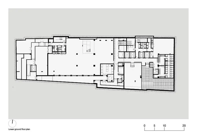 Lower ground floor plan drawing revealing two large volumes separated by circulation and support spaces
