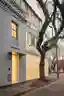 Ian Moore Architects Turns a 156-Year-Old Sydney Corner Shop into a Glass Brick Residence