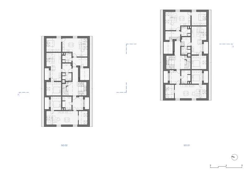 Floor plan drawing showing two multi-unit residential buildings with thick perimeter walls and shared circulation cores