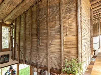 La Cabina de la Curiosidad Suspends Two Bedroom Nests from the Ceiling of a Converted Warehouse in Ecuador