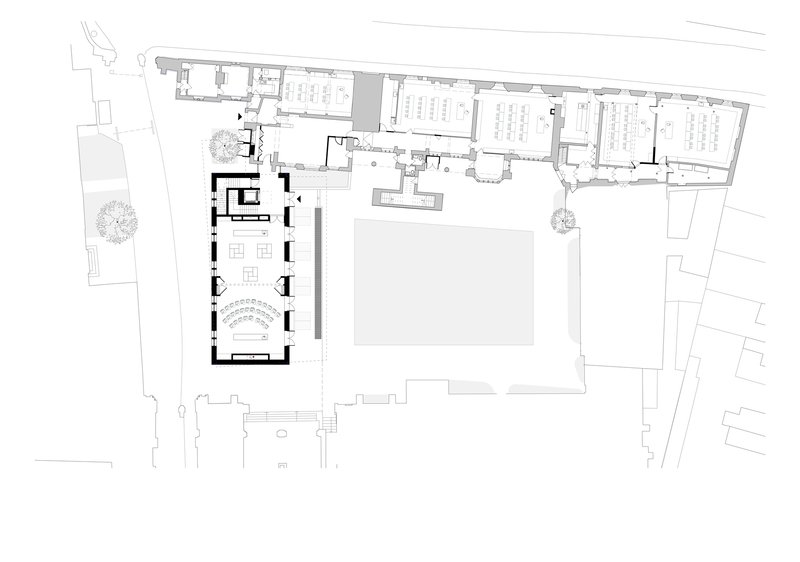 Ground floor plan drawing showing the chapel with curved seating and adjacent courtyard and buildings