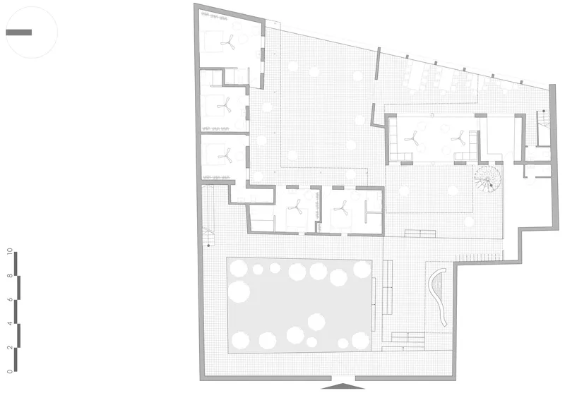 Floor plan drawing showing rooms arranged around a central pool with perimeter courtyard spaces