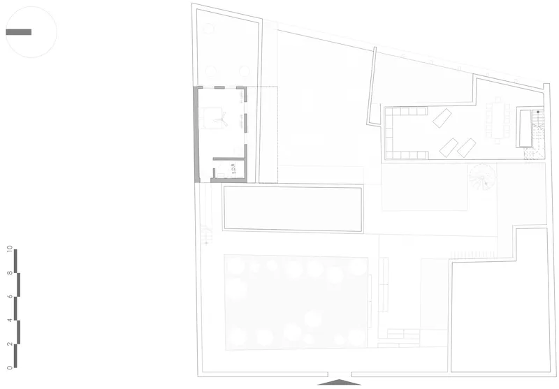 Floor plan drawing showing two rectangular pools with surrounding decks and service rooms at perimeter