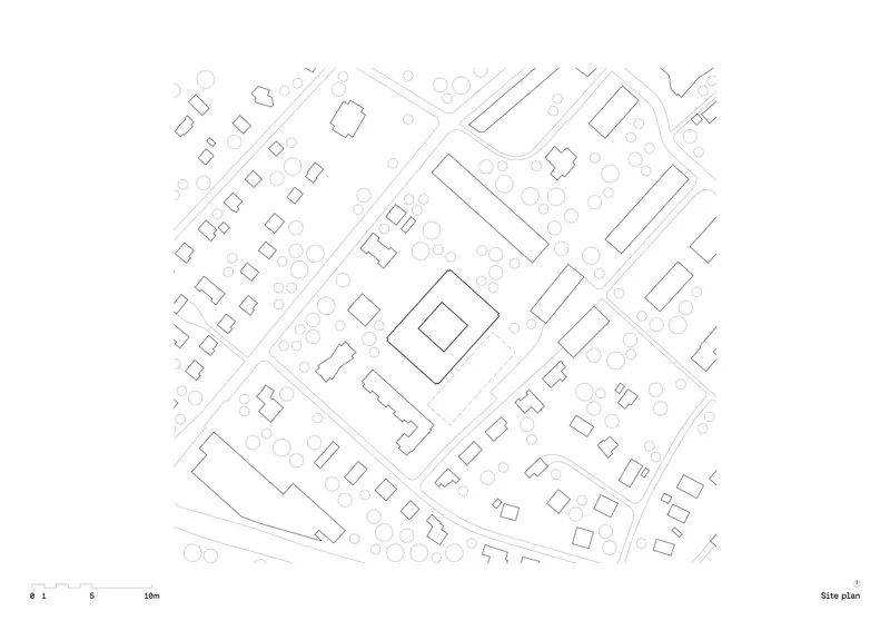 Site plan drawing showing the building footprint surrounded by existing trees and adjacent street patterns