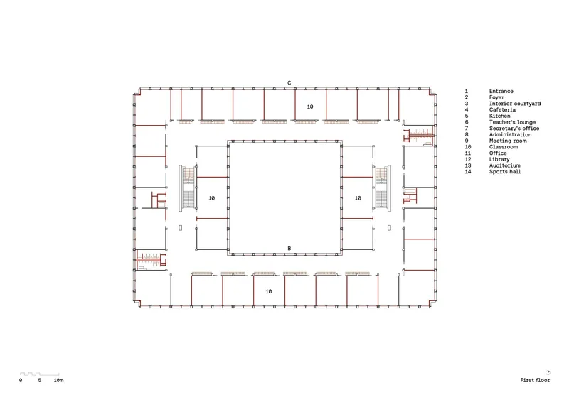 First floor plan drawing showing classrooms arranged around a central void with staircases at opposite corners