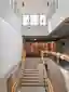 Burckhardt Lifts a Timber Story onto a 1969 Brutalist School in Geneva Without Breaking the Spell