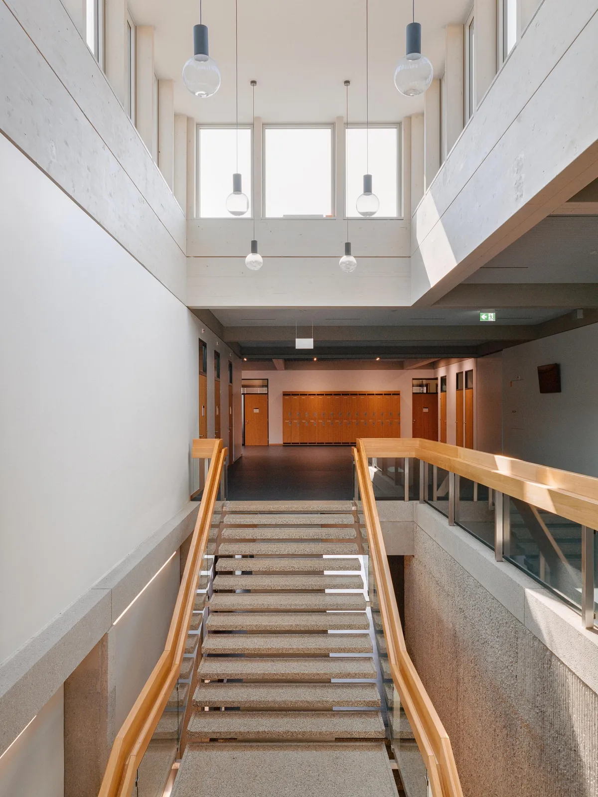Burckhardt Lifts a Timber Story onto a 1969 Brutalist School in Geneva Without Breaking the Spell