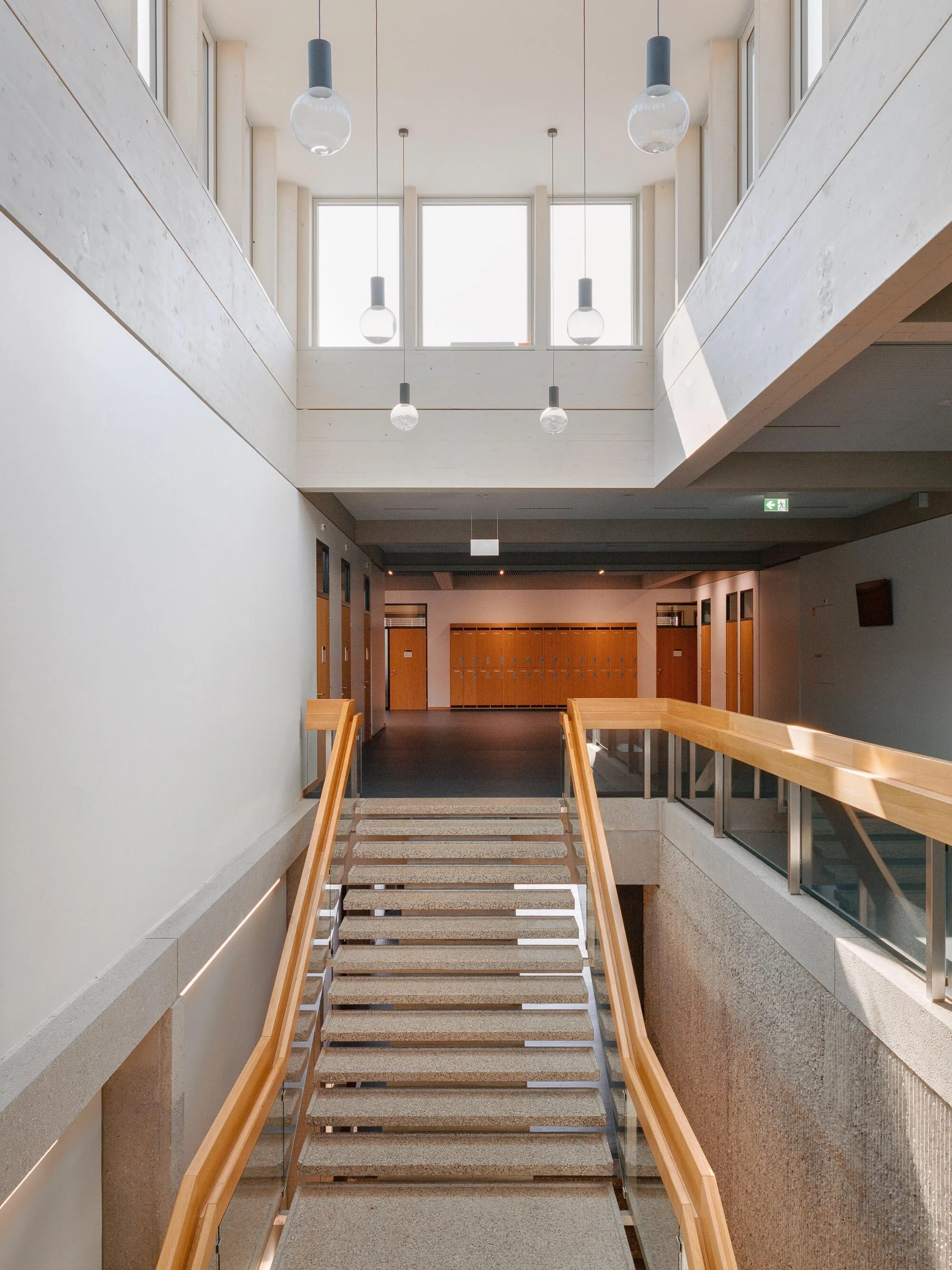 Burckhardt Lifts a Timber Story onto a 1969 Brutalist School in Geneva Without Breaking the Spell