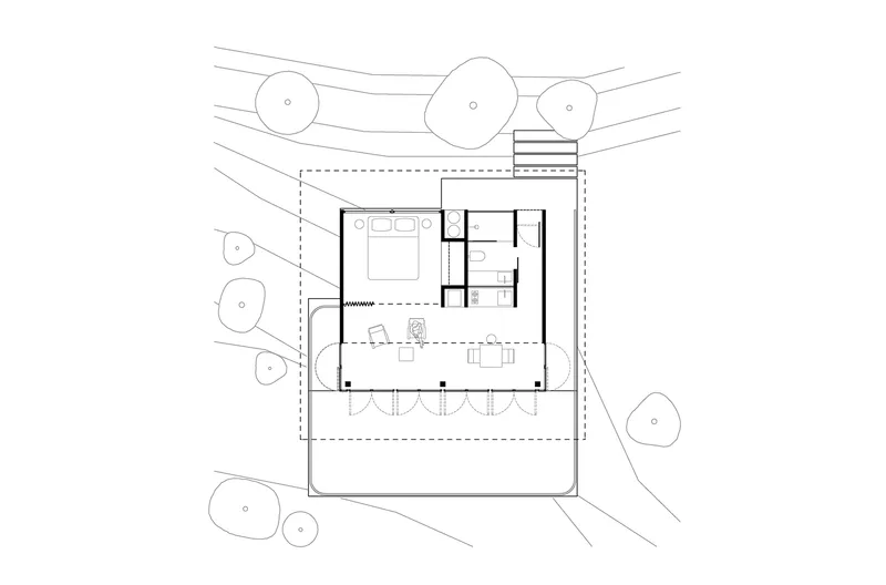 Floor plan drawing showing enclosed service core and open living area surrounded by deck and trees