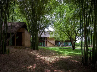 PAVA Architects Rebuilds an Abandoned Rice Mill into a Mekong Riverfront House in Thailand