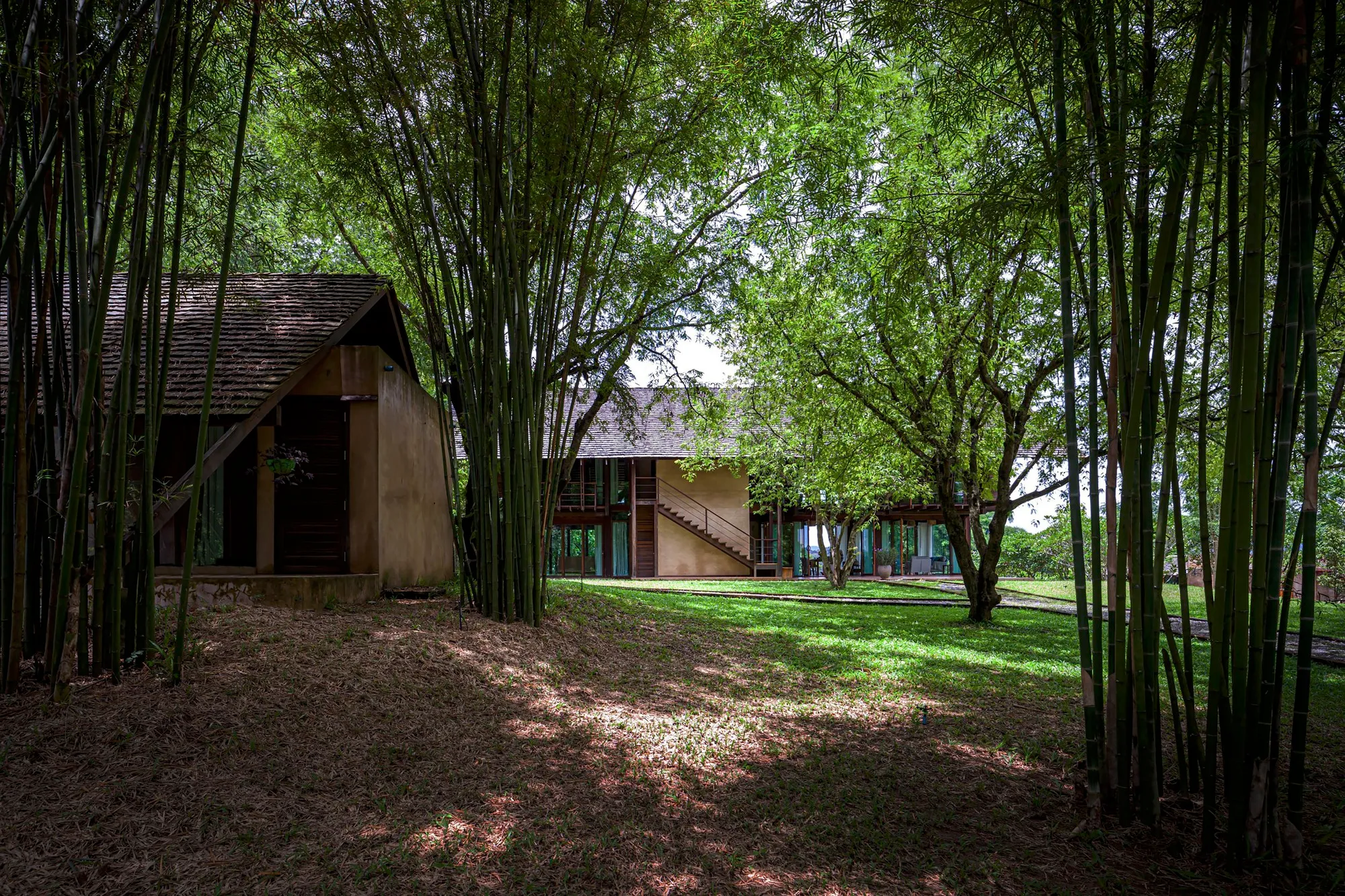 PAVA Architects Rebuilds an Abandoned Rice Mill into a Mekong Riverfront House in Thailand