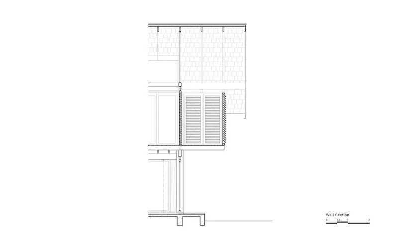 Wall section detail drawing illustrating layered construction from foundation to roof assembly