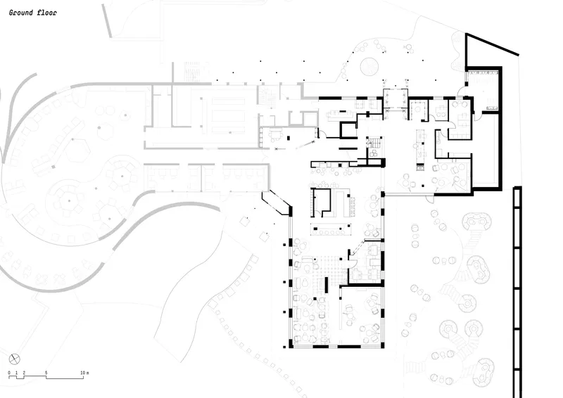 Ground floor plan showing curved pathways through planted areas connecting to orthogonal interior rooms