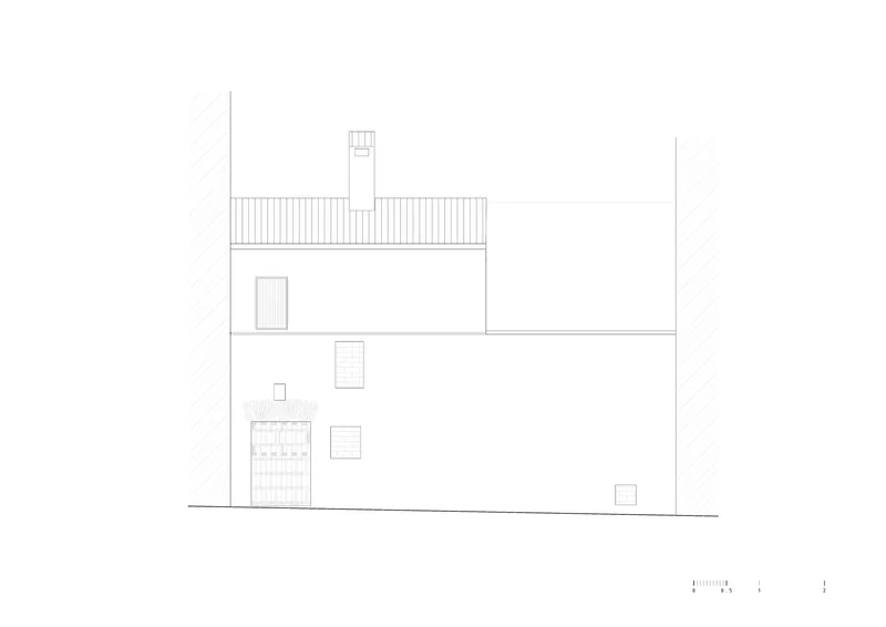 Elevation drawing showing a three-story volume with scattered windows, pitched roof, and neighboring building walls