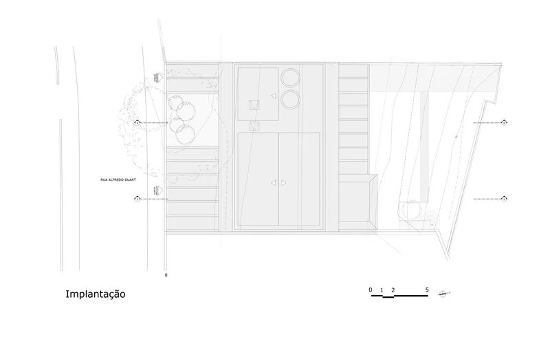 Site plan drawing showing terraced outdoor spaces and landscape planting along one edge