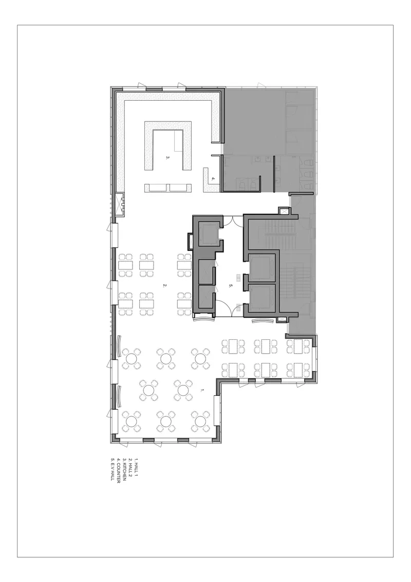 Floor plan drawing showing dining areas with tables, a central service core, and outdoor terrace spaces