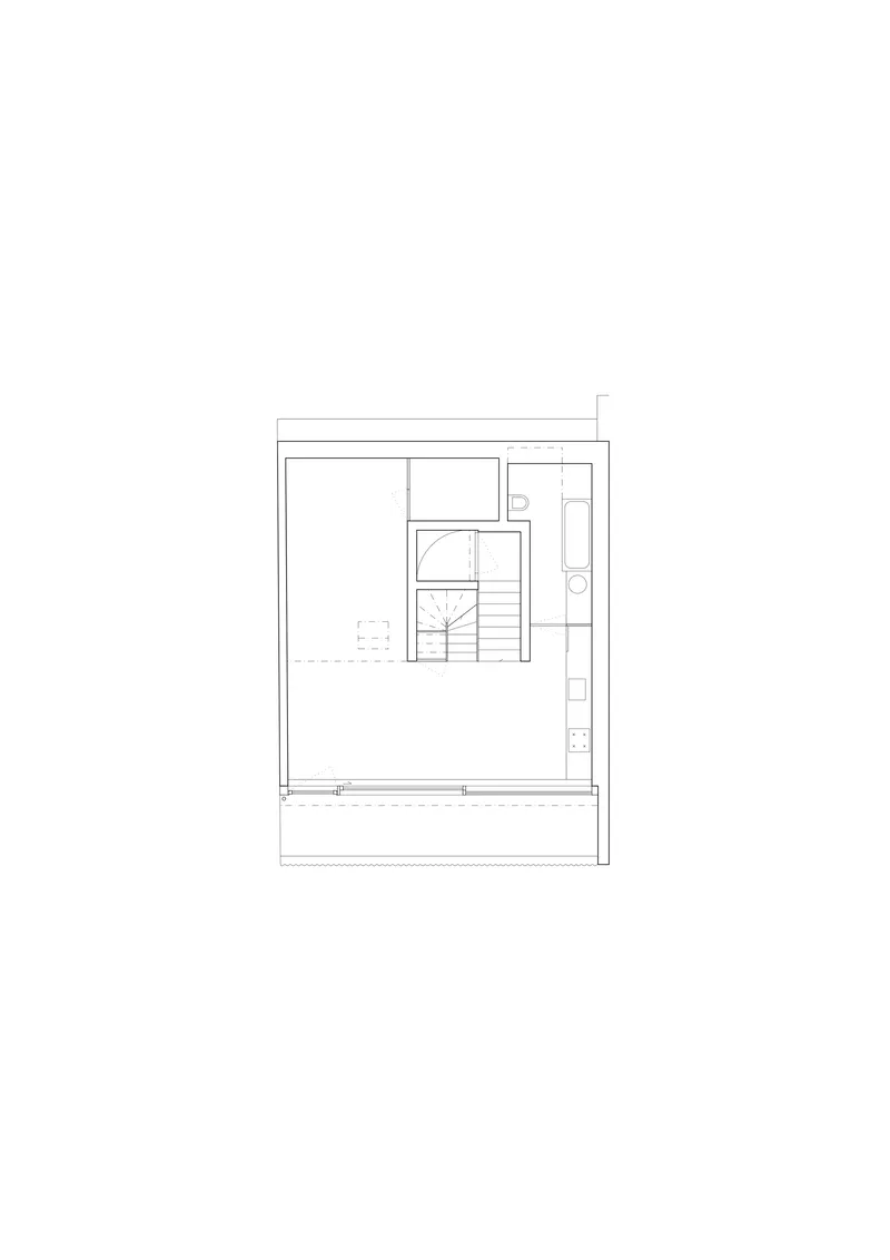 Floor plan drawing showing an open space with central spiral stair and side service core