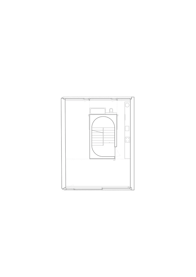Floor plan drawing showing a compact level with curved stair element and narrow service zone