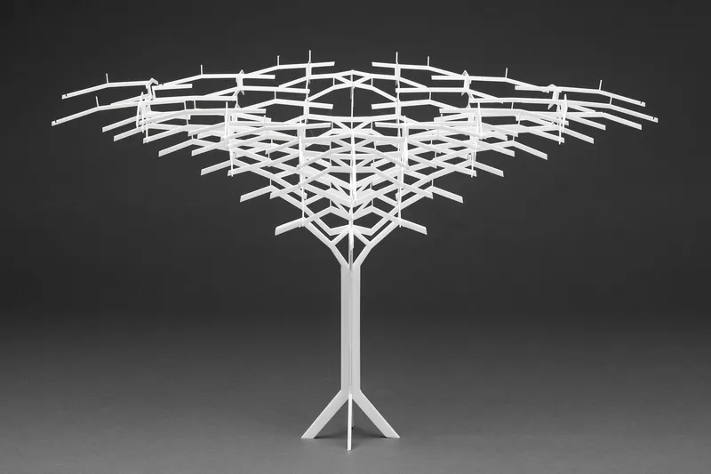 Physical model of a latticed canopy structure with intersecting beams radiating from a central branching column