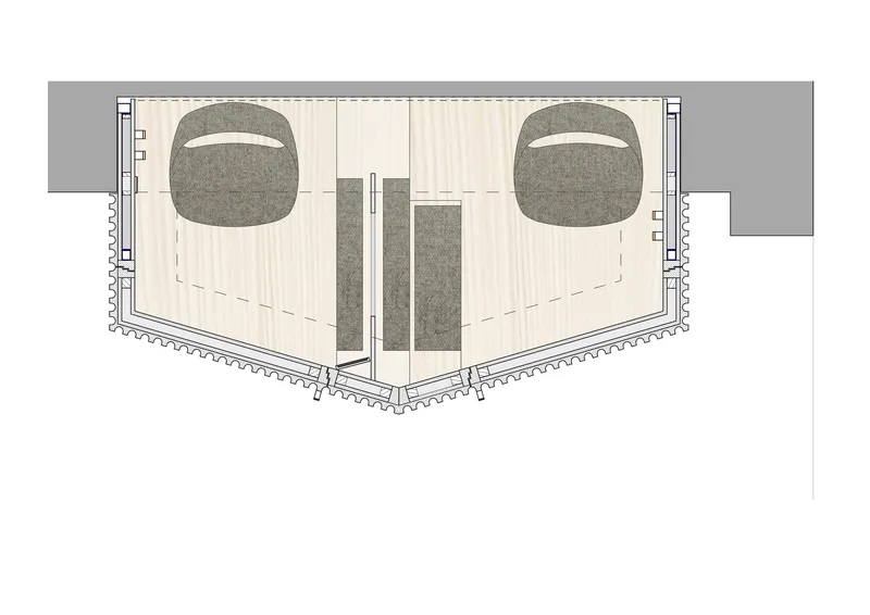 Floor plan drawing showing twin confessional volumes with curved seating areas and central entry