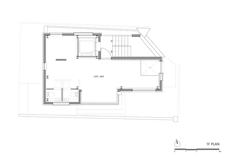 First floor plan drawing showing cafe and bar space with restrooms and staircase