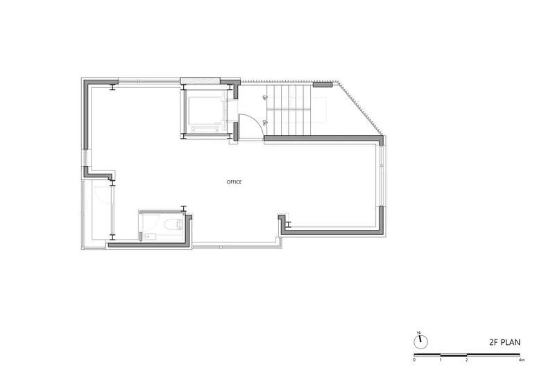 Second floor plan drawing showing open office space with bathroom and stair