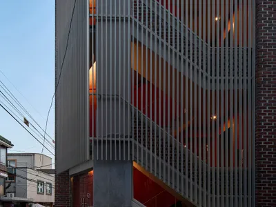 skimA Slots a Vertical Metal Tower into a Yeonnam-dong Brick House to Make It Mixed Use