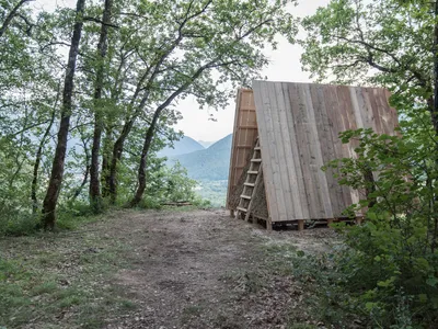 Still at Work Plants a Hay-Walled A-Frame Pavilion on a French Cliff for Cows and Humans Alike
