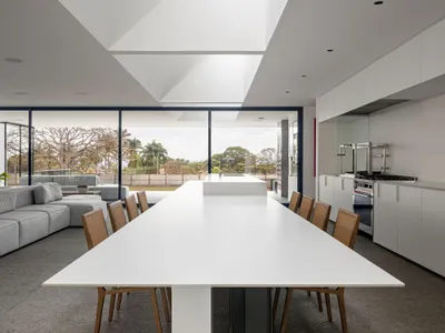 BLOCO Arquitetos Designs a Brasilia Home Around Five Inverted Beams and a Private Art Gallery