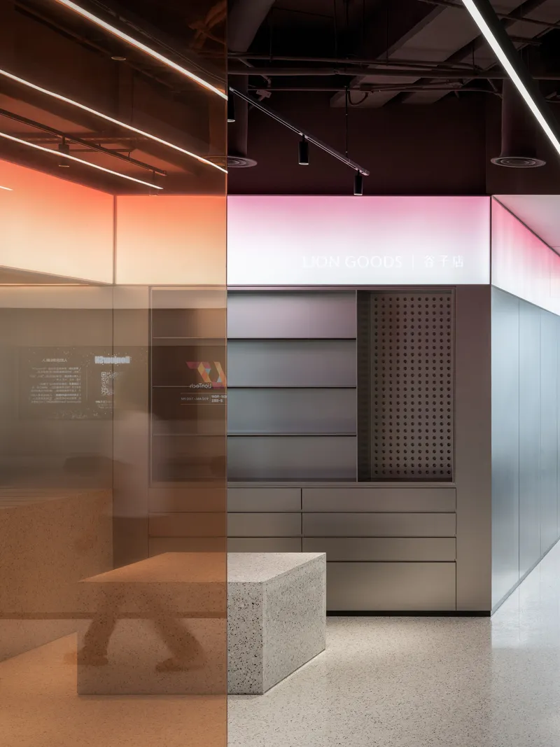 This architectural image showcases a modern retail interior with a minimalist design. The space features terrazzo flooring, clean lines, and a monochromatic col