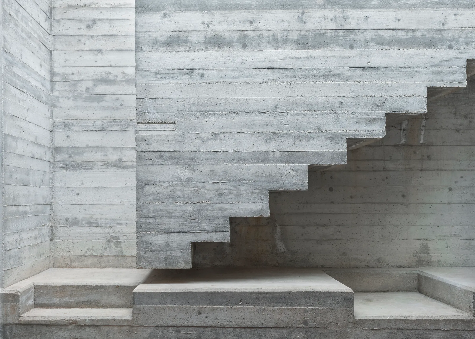 MODEL Carves a Scarpa-Inspired Concrete Core Through a Maltese Period House for Two Sisters